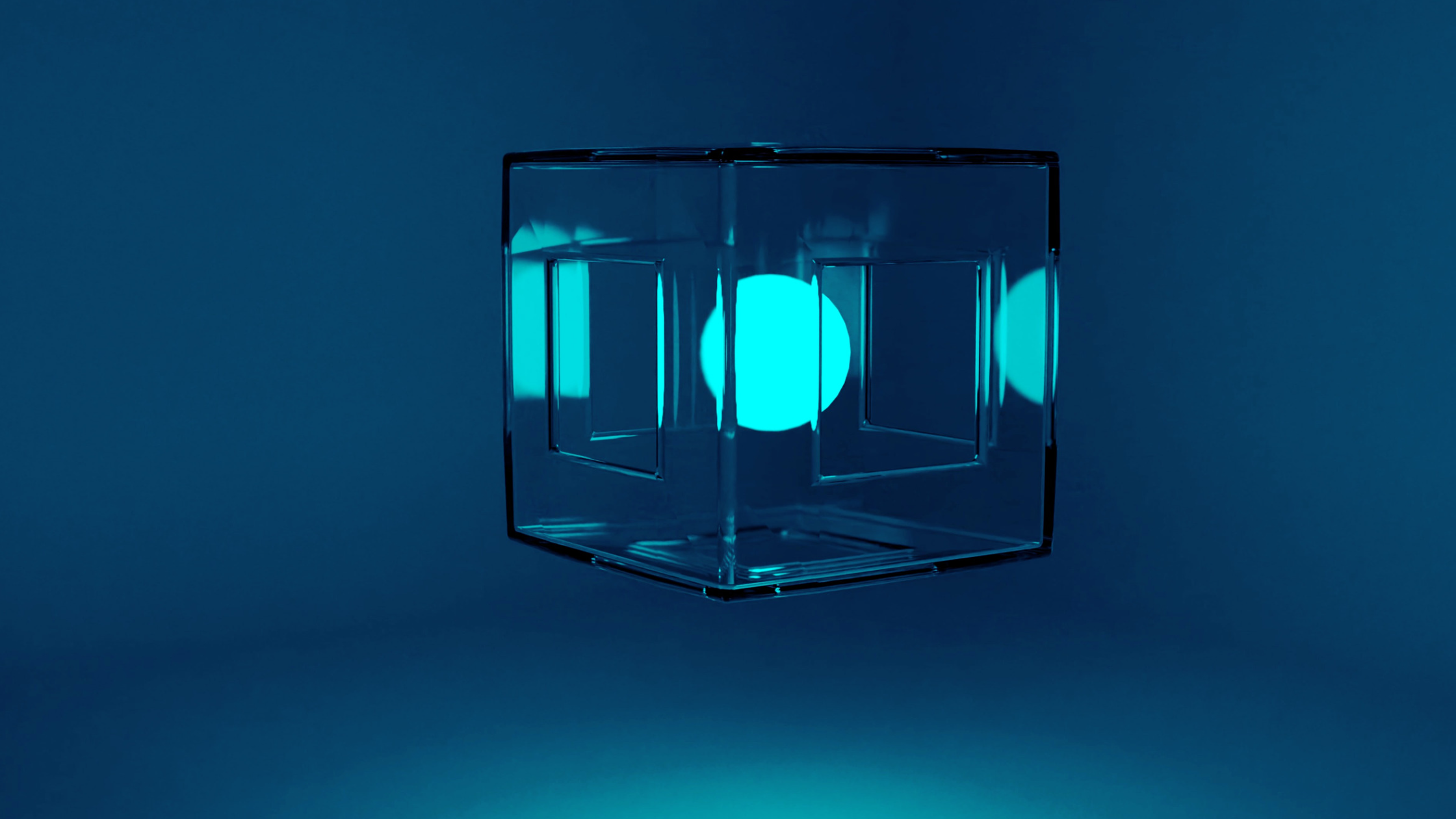 Glass cube with glowing ball in the center with teal tint overall